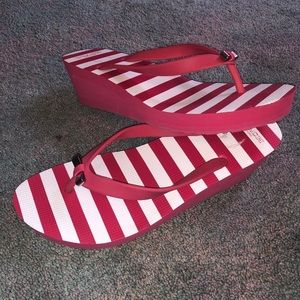 Hot pink striped COACH wedge flip flops